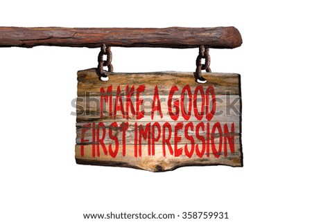 Make a good first impression motivational phrase sign on old wood with blurred background