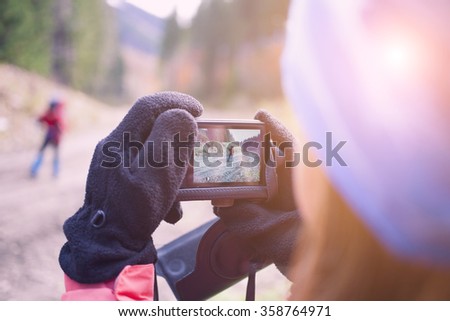 Model photographing people while traveling. 