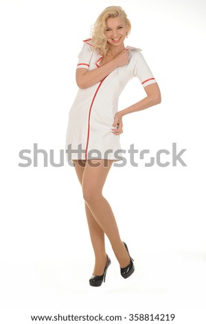 beautiful blonde nurse wearing white dress