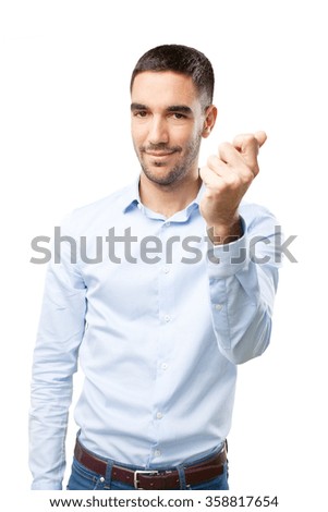 Young man with a gesture of money