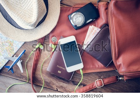 Travel accessories costumes. Passports, luggage, The cost of travel maps prepared for the trip Royalty-Free Stock Photo #358819604