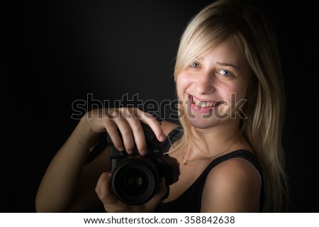pretty young woman with camera