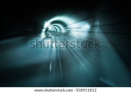 Abstract traffic background. Dark underground tunnel with blurred light tracks. Motion blur