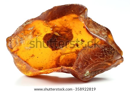 north sea amber with another amber included isolated on white background Royalty-Free Stock Photo #358922819
