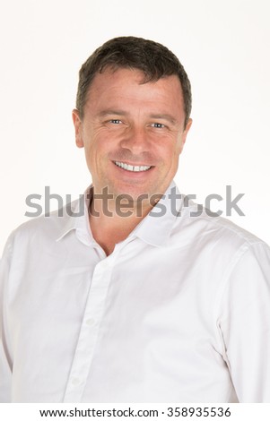 Studio picture of handsome man posing isolated with a white shirt