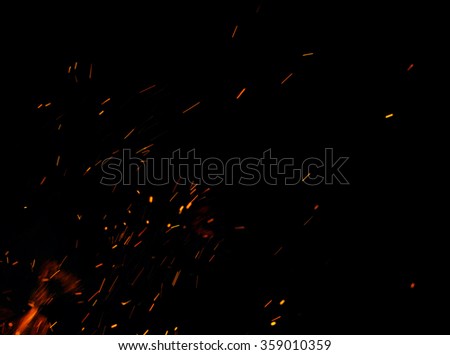 fire flames with sparks on a black background Royalty-Free Stock Photo #359010359