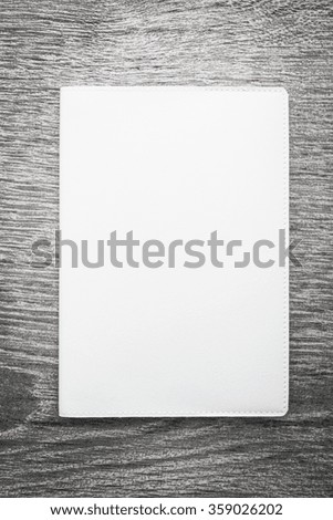 Blank white mock up book on wooden background - filter effect processing