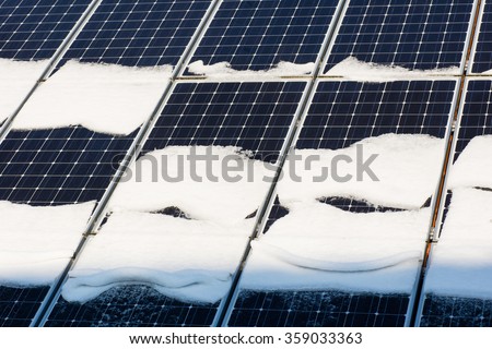 Photovoltaic in winter covered with snow Royalty-Free Stock Photo #359033363