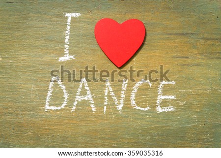 Text i love dance written with chalk in old board wooden.