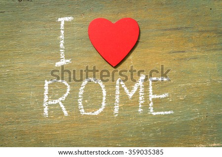 Text i love Rome written with chalk in old board wooden.