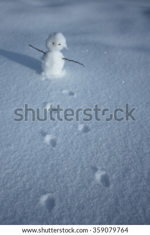 Snowman. traces of the snowman. Cute picture with a snowman