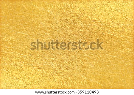 Shiny yellow leaf gold foil texture background Royalty-Free Stock Photo #359110493