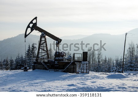 Rig for extraction oil , on  snow in the mountains 