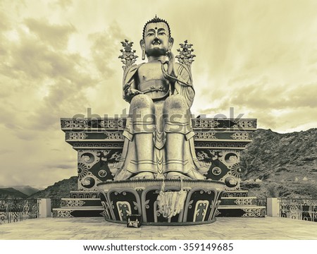 Giant golden sculpture of the Mitreya Buddha in the monastery of Likir (Likir Gompa) - Tibet, Leh district, Ladakh, Himalayas, Jammu and Kashmir, Northern India (stylized retro)