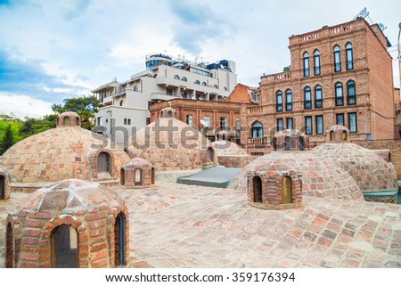 Old georgian baths in Tbilisi is sunny day Royalty-Free Stock Photo #359176394