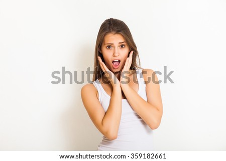 beautiful young girl in fear in the studio on a white background