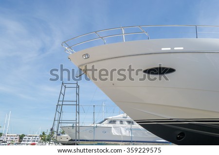 Luxury yacht waiting for service and repair  Royalty-Free Stock Photo #359229575