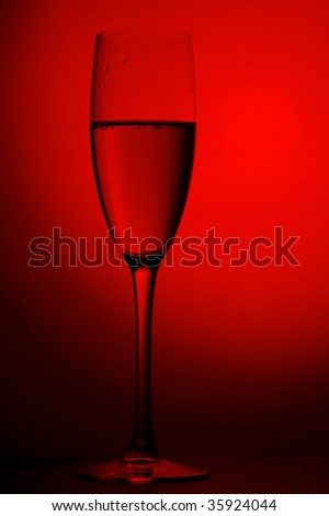 object on red - champagne glasses close up