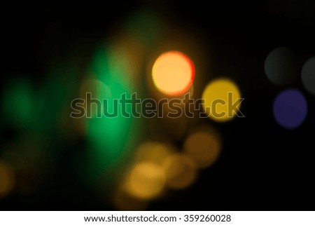 Abstract circular bokeh lighting in the night can be used for background and text input