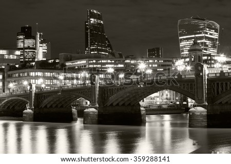 London nights from the piers with Canary Wharf view. Black and white photography