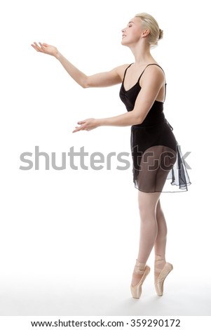 graceful ballerina on pointe shot in the studio on white background