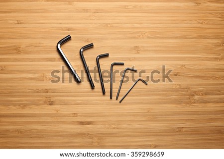 hex keys on a wooden background