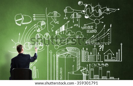 Businessman drawing business strategy
