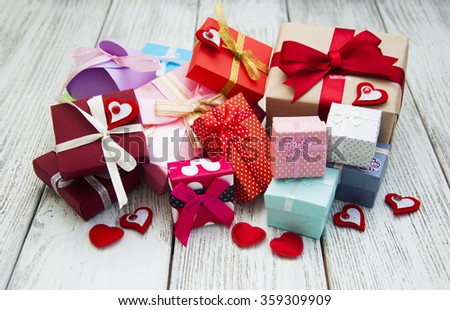 Colorful gift boxes on a white wooden background