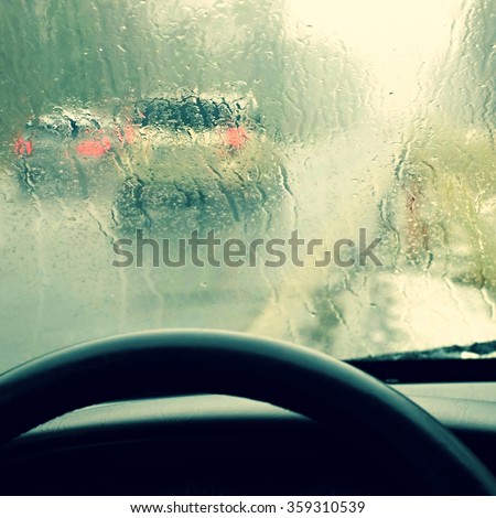 Driving from the driver's perspective in bad weather in the snow and rain.