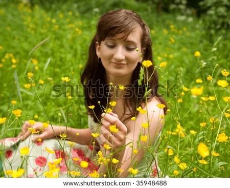 portrait of young woman in the summer garden