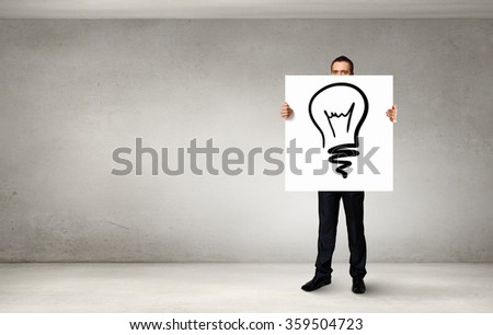 Businessman demonstrating banner with ideas