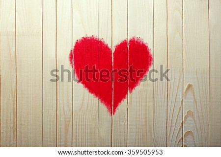 Heart painted on wooden wall