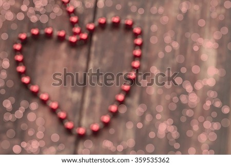 blurred  red heart on a wooden table. Background Valentine's day