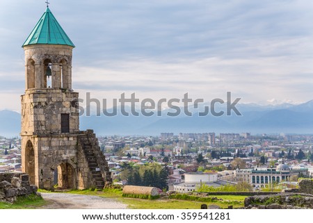  belfry at Bagrati Cathedral (Cathedral of the Dormition) in Kutaisi, Georgia with views of the Caucasus Royalty-Free Stock Photo #359541281