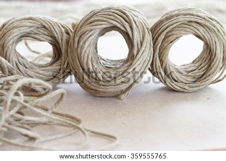 A roll of brown coir rope in selective focus