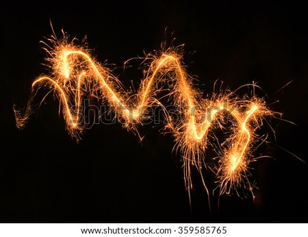 swinging, sparkling and glowing fireworks in dark back