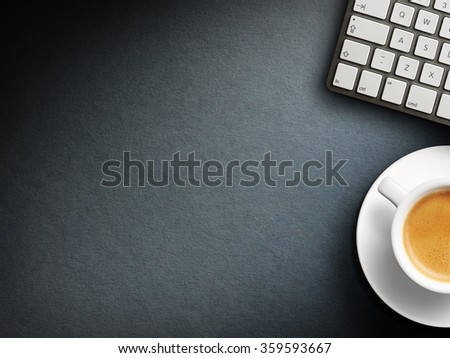 Coffee mug on the table with a keyboard. Close up