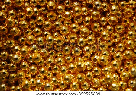 Seamless pattern with golden beads.