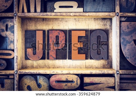The word "JPEG" written in vintage wooden letterpress type.
