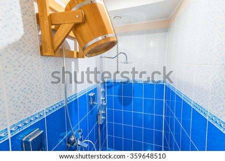 Horizontal photo a shower room without the people blue color