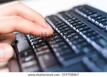 Human typing on keyboard