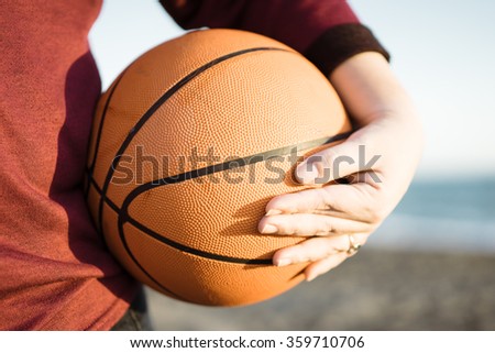 woman holding a ball