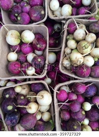 Overhead picture of punnets of radishes at a London farmers' market