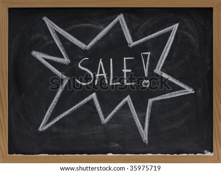 sale announcement sketched with white chalk on a blackboard
