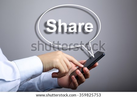 Businessman using smart phone with Share speech bubble against gradually varied background.