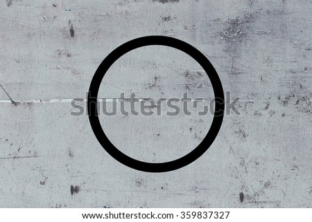 Black flat circle on abstract concrete background. Abstract psychedelic background. 