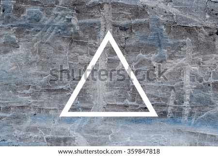 White flat triangle on abstract stone background. Abstract psychedelic background. 