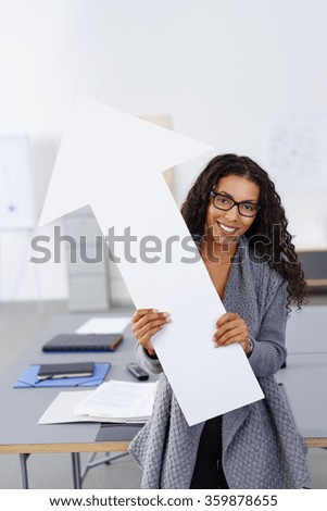 business woman pointing upwards with a white arrow