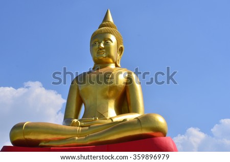 Golden Buddha statue in the daytime.