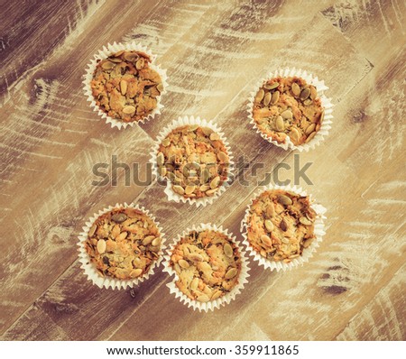 Handmade Savoury Blue Cheese Cupcakes on vintage wooden background, aerial top view, toned filter applied
